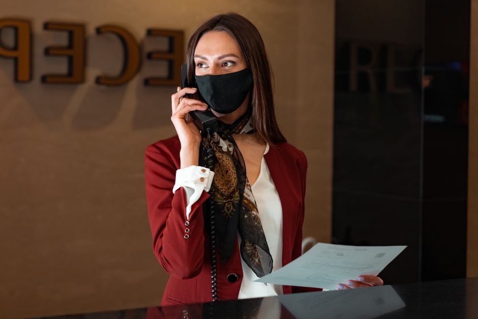 Clinic receptionist taking a call